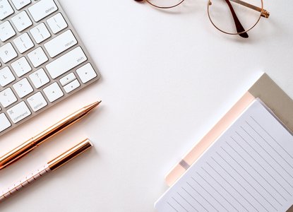 Writing next to computer
