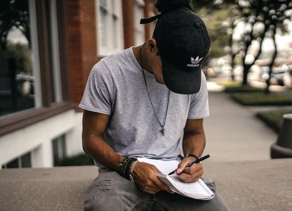 Young man writing