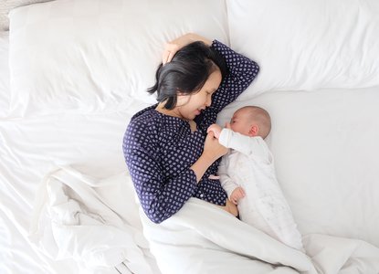 Mum and baby in bed